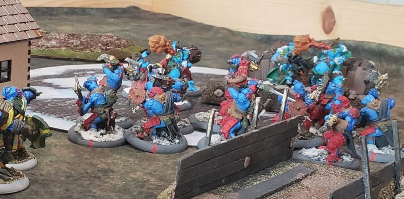 Trollblood Kriel Warriors, converted from fennblades take to a trench in front of two units of Northkin Fire Eaters.